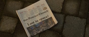 Movie still from “Rise of the Planet of the Apes” (2011), directed by Rupert Wyatt – A san francisco chronicle newspaper laying on the ground; Extreme Close Up shot, Overhead angle
