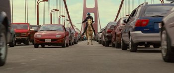 Movie still from “Rise of the Planet of the Apes” (2011), directed by Rupert Wyatt – A man riding a horse across a bridge; Wide shot, Low angle
