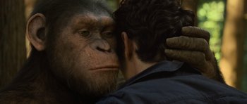 Movie still from “Rise of the Planet of the Apes” (2011), directed by Rupert Wyatt – A man touching the face of a gorilla; Close Up shot, Over the shoulder angle
