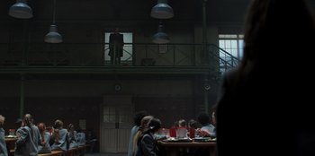 Movie still from “Roald Dahl's Matilda the Musical” (2022), directed by Matthew Warchus – A group of people sitting at a table in a room; Wide shot, Low angle