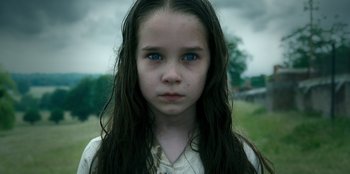 Movie still from “Roald Dahl's Matilda the Musical” (2022), directed by Matthew Warchus – A young girl with blue eyes and long dark hair; Close Up shot, High angle
