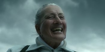 Movie still from “Roald Dahl's Matilda the Musical” (2022), directed by Matthew Warchus – An older woman with a big smile on her face; Close Up shot, Low angle