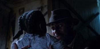 Movie still from “Roald Dahl's Matilda the Musical” (2022), directed by Matthew Warchus – A man and a little girl in a room; Close Up shot, Over the shoulder angle