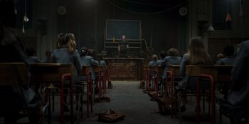 Movie still from “Roald Dahl's Matilda the Musical” (2022), directed by Matthew Warchus – A classroom full of students sitting at their desks; Wide shot, High angle