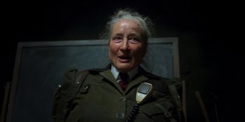 Movie still from “Roald Dahl's Matilda the Musical” (2022), directed by Matthew Warchus – An old woman with a phone in her hand; Close Up shot, Over the shoulder angle
