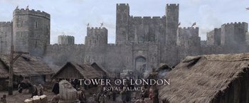 Movie still from “Robin Hood” (2010), directed by Ridley Scott – A medieval castle with people standing around it; Extreme Wide shot, Low angle