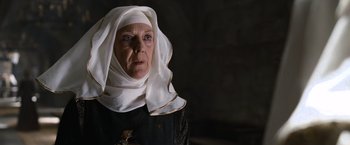Movie still from “Robin Hood” (2010), directed by Ridley Scott – An older woman wearing a white head covering; Close Up shot, Low angle