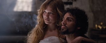 Movie still from “Robin Hood” (2010), directed by Ridley Scott – A man and a woman posing for a picture; Close Up shot, Low angle