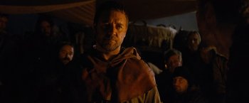 Movie still from “Robin Hood” (2010), directed by Ridley Scott – A person wearing a robe; Close Up shot, Over the shoulder angle