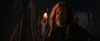 Movie still from “Robin Hood” (2010), directed by Ridley Scott – A man with long hair and a long beard; Close Up shot, Over the shoulder angle