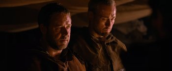 Movie still from “Robin Hood” (2010), directed by Ridley Scott – A couple of men standing next to each other; Close Up shot, Low angle