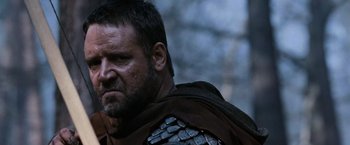 Movie still from “Robin Hood” (2010), directed by Ridley Scott – A person wearing armor; Close Up shot, Low angle