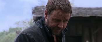 Movie still from “Robin Hood” (2010), directed by Ridley Scott – A person wearing a leather jacket; Close Up shot, Over the shoulder angle