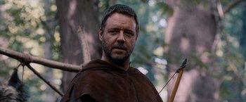 Movie still from “Robin Hood” (2010), directed by Ridley Scott – A person with a bow and arrow; Close Up shot, Low angle