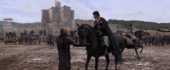Movie still from “Robin Hood” (2010), directed by Ridley Scott – A man on a black horse and a man on a black horse; Wide shot, Over the shoulder angle