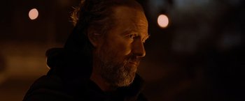 Movie still from “Robin Hood” (2010), directed by Ridley Scott – A person with a beard looking to his left; Close Up shot, Over the shoulder angle