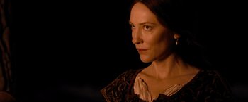 Movie still from “Robin Hood” (2010), directed by Ridley Scott – A person wearing a dress; Close Up shot, Over the shoulder angle