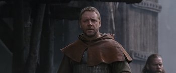 Movie still from “Robin Hood” (2010), directed by Ridley Scott – A person wearing a costume; Medium shot, Low angle