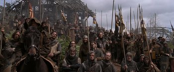 Movie still from “Robin Hood” (2010), directed by Ridley Scott – A large group of people dressed in medieval clothing; Wide shot, Low angle