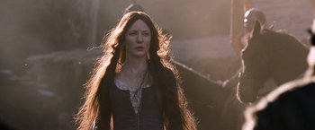 Movie still from “Robin Hood” (2010), directed by Ridley Scott – A woman with long brown hair standing in a field; Medium shot, Low angle