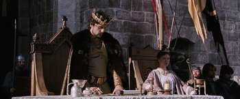 Movie still from “Robin Hood” (2010), directed by Ridley Scott – A man and a woman dressed as a king and queen; Medium shot, Low angle