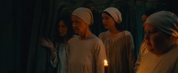 Movie still from “Benedetta” (2021), directed by Paul Verhoeven – A group of women standing next to each other; Medium shot, Low angle