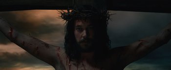 Movie still from “Benedetta” (2021), directed by Paul Verhoeven – A man with a crown of thorns on his head; Close Up shot, Low angle