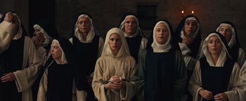Movie still from “Benedetta” (2021), directed by Paul Verhoeven – A group of nuns standing next to each other; Medium shot, High angle