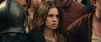 Movie still from “Benedetta” (2021), directed by Paul Verhoeven – A person with long brown hair; Close Up shot, Over the shoulder angle