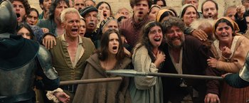 Movie still from “Benedetta” (2021), directed by Paul Verhoeven – A group of people that are standing in a crowd; Medium shot, High angle