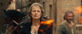 Movie still from “Benedetta” (2021), directed by Paul Verhoeven – An older woman is looking into the camera; Close Up shot, Over the shoulder angle