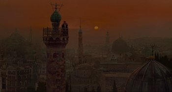 Movie still from “Robin Hood: Prince of Thieves” (1991), directed by Kevin Reynolds – Two people standing on top of a tall tower; Extreme Wide shot, Low angle