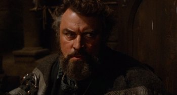 Movie still from “Robin Hood: Prince of Thieves” (1991), directed by Kevin Reynolds – A person with a beard; Close Up shot, Low angle