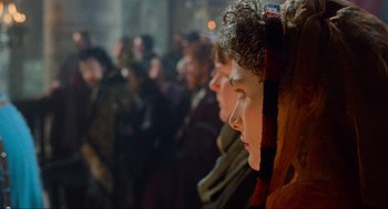Movie still from “Robin Hood: Prince of Thieves” (1991), directed by Kevin Reynolds – A group of people standing in front of a crowd; Close Up shot, Over the shoulder angle
