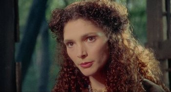 Movie still from “Robin Hood: Prince of Thieves” (1991), directed by Kevin Reynolds – A person with curly hair; Close Up shot, Over the shoulder angle
