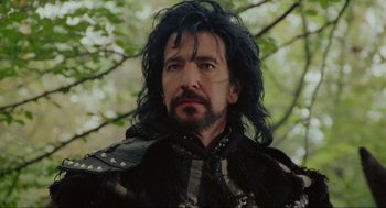 Movie still from “Robin Hood: Prince of Thieves” (1991), directed by Kevin Reynolds – A person with long black hair; Close Up shot, Low angle