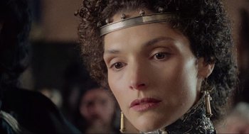 Movie still from “Robin Hood: Prince of Thieves” (1991), directed by Kevin Reynolds – A person wearing a crown; Close Up shot, Over the shoulder angle