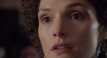 Movie still from “Robin Hood: Prince of Thieves” (1991), directed by Kevin Reynolds – A woman's face looking at the camera; Extreme Close Up shot, Low angle