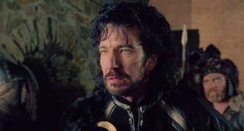 Movie still from “Robin Hood: Prince of Thieves” (1991), directed by Kevin Reynolds – A person wearing a jacket; Close Up shot, Over the shoulder angle