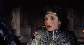 Movie still from “Robin Hood: Prince of Thieves” (1991), directed by Kevin Reynolds – A person wearing a costume; Close Up shot, Over the shoulder angle