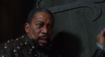 Movie still from “Robin Hood: Prince of Thieves” (1991), directed by Kevin Reynolds – A person with a beard; Close Up shot, Over the shoulder angle