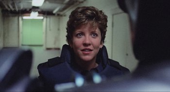 Movie still from “RoboCop” (1987), directed by Paul Verhoeven – A person wearing a jacket; Close Up shot, Over the shoulder angle