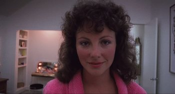 Movie still from “RoboCop” (1987), directed by Paul Verhoeven – A person wearing a pink sweater; Close Up shot, Low angle