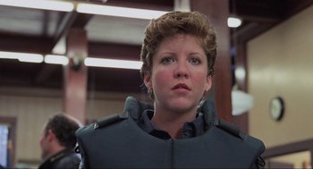 Movie still from “RoboCop” (1987), directed by Paul Verhoeven – A person wearing a uniform; Close Up shot, Low angle