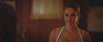 Movie still from “Robots” (2023), directed by Casper Christensen – A beautiful young lady wearing a pink tank top; Close Up shot, Over the shoulder angle