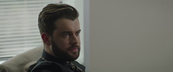 Movie still from “Robots” (2023), directed by Casper Christensen – A person wearing a suit and tie; Close Up shot, Over the shoulder angle