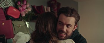 Movie still from “Robots” (2023), directed by Casper Christensen – A man and a woman hugging in a room; Close Up shot, Over the shoulder angle