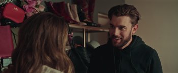 Movie still from “Robots” (2023), directed by Casper Christensen – A man and a woman talking to each other in a room; Close Up shot, Over the shoulder angle