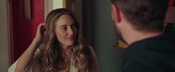 Movie still from “Robots” (2023), directed by Casper Christensen – A woman is looking at a man in the mirror; Close Up shot, Over the shoulder angle