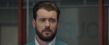 Movie still from “Robots” (2023), directed by Casper Christensen – A person with a beard; Close Up shot, Over the shoulder angle